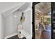 Cozy entryway featuring hooks, bench, storage, and view into the living area at 101 Ferndale Ct, Clayton, NC 27520