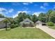 Lovely home with a well-maintained lawn, lush landscaping, and a detached two-car garage at 101 Ferndale Ct, Clayton, NC 27520