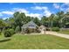 Charming home with a manicured lawn, mature trees, and a detached garage offers curb appeal at 101 Ferndale Ct, Clayton, NC 27520