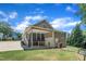 Rear view of the home featuring covered outdoor space and well-maintained backyard at 101 Ferndale Ct, Clayton, NC 27520