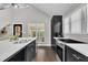 Well-lit kitchen with a large sink and modern appliances under high, vaulted ceilings at 101 Ferndale Ct, Clayton, NC 27520