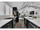 Spacious kitchen with stainless steel appliances, ample counter space, and an open layout to the dining area at 101 Ferndale Ct, Clayton, NC 27520
