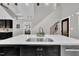 Open concept kitchen with a stainless steel sink, pendant lighting, and seamless flow to other living spaces at 101 Ferndale Ct, Clayton, NC 27520