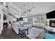 Open living room boasts high ceilings, a fireplace, a large sofa, and stylish decor at 101 Ferndale Ct, Clayton, NC 27520