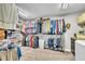 Well-organized walk-in closet with ample storage for clothing, shoes, and accessories at 101 Ferndale Ct, Clayton, NC 27520