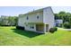 A spacious backyard with a lush green lawn and mature trees at 103 Bermuda Green Dr, Durham, NC 27703