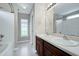 This bathroom is equipped with double sinks, framed mirrors, and updated fixtures at 103 Bermuda Green Dr, Durham, NC 27703