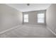 Bright bedroom with two windows and plush carpeting throughout at 103 Bermuda Green Dr, Durham, NC 27703