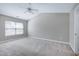 Spacious bedroom with neutral carpeting and a ceiling fan for added comfort at 103 Bermuda Green Dr, Durham, NC 27703