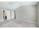 Large bedroom features neutral carpets, a ceiling fan, and easy bath access at 103 Bermuda Green Dr, Durham, NC 27703