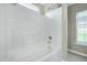 Bright bathroom with a stand up shower, window, and chrome fixtures at 103 Bermuda Green Dr, Durham, NC 27703