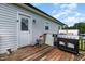 Spacious back deck featuring wooden flooring and a modern grill, perfect for outdoor entertaining at 11 Sherman Rd, Fuquay Varina, NC 27526