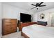 Bedroom features a ceiling fan, hardwood furniture, and ample storage space for an organized living space at 11 Sherman Rd, Fuquay Varina, NC 27526