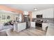 Kitchen with stainless steel appliances, gray backsplash, island and an open floorplan at 11 Sherman Rd, Fuquay Varina, NC 27526