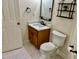 A bathroom featuring a wood vanity with marble counter top, mirror and a toilet at 1121 Brookhill Way, Cary, NC 27519