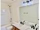 Bathroom featuring double sink vanity, large mirror, and shower-tub combo at 1121 Brookhill Way, Cary, NC 27519