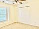 Bedroom featuring closet with sliding doors and a ceiling fan at 1121 Brookhill Way, Cary, NC 27519