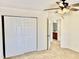 Bedroom with neutral carpet, ceiling fan, and view of bathroom at 1121 Brookhill Way, Cary, NC 27519
