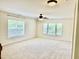 Bonus room featuring neutral carpet, ceiling fan, and multiple windows at 1121 Brookhill Way, Cary, NC 27519