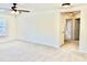 Bonus room featuring neutral carpet, ceiling fan, and view of hallway at 1121 Brookhill Way, Cary, NC 27519