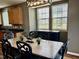 Dining area features a table and chairs with natural light at 1121 Brookhill Way, Cary, NC 27519
