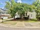 Inviting home featuring a two-car garage and well-maintained landscaping at 1121 Brookhill Way, Cary, NC 27519