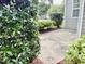 A side view of a home with a lush green bush at 1121 Brookhill Way, Cary, NC 27519