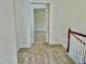 Hallway leading to bonus room with carpeted floors at 1121 Brookhill Way, Cary, NC 27519