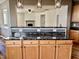 Kitchen features a marble countertop and wooden cabinets at 1121 Brookhill Way, Cary, NC 27519