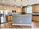 Spacious kitchen features stainless steel appliances and ample storage at 1121 Brookhill Way, Cary, NC 27519