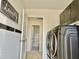 Bright laundry room features a washer and dryer, cabinets, and stylish 'Laundry Stinks' sign at 1121 Brookhill Way, Cary, NC 27519