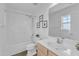 Clean bathroom with a single sink vanity and a shower-tub combination for everyday convenience at 11309 Shadow Elms Lane Ln, Raleigh, NC 27614