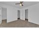 Spacious bedroom featuring neutral carpet, a ceiling fan and access to the bathroom and walk-in closet at 11309 Shadow Elms Lane Ln, Raleigh, NC 27614