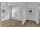 Bright dining room features wood-look floors, modern lighting, and a large window with natural light at 11309 Shadow Elms Lane Ln, Raleigh, NC 27614