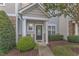 Inviting front entrance with a decorative door and manicured landscaping creates excellent curb appeal at 11309 Shadow Elms Lane Ln, Raleigh, NC 27614