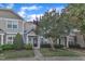 Beautiful townhome with charming landscape, a well-maintained lawn, and appealing front entrance with a black door at 11309 Shadow Elms Lane Ln, Raleigh, NC 27614