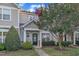 Charming home with a manicured lawn, stone accents, and a welcoming front entrance with lovely landscaping at 11309 Shadow Elms Lane Ln, Raleigh, NC 27614