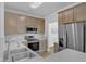Spacious kitchen boasts stainless steel appliances, ample counter space, and stylish neutral finishes at 11309 Shadow Elms Lane Ln, Raleigh, NC 27614