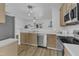 Well-equipped kitchen featuring stainless steel appliances, light wood cabinetry, and an open layout at 11309 Shadow Elms Lane Ln, Raleigh, NC 27614
