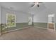 Main bedroom with two large windows, neutral carpet and paint, and ceiling fan at 11309 Shadow Elms Lane Ln, Raleigh, NC 27614