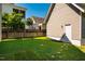 A spacious backyard featuring green grass and a wooden fence at 1168 Great Ridge Pkwy, Chapel Hill, NC 27516