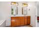 Elegant bathroom featuring double sinks, modern fixtures and lighting at 1168 Great Ridge Pkwy, Chapel Hill, NC 27516