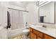 Bathroom with a shower and tub combo and oak vanity at 1168 Great Ridge Pkwy, Chapel Hill, NC 27516