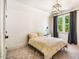 Bright bedroom with neutral carpet, natural light, and gray curtains at 1168 Great Ridge Pkwy, Chapel Hill, NC 27516