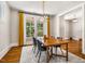 Bright dining room offers a cozy atmosphere with modern light fixture and view of the outdoors at 1168 Great Ridge Pkwy, Chapel Hill, NC 27516