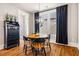 Dining room with hardwood floors and modern lighting at 1168 Great Ridge Pkwy, Chapel Hill, NC 27516