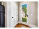 Bright entryway with white doors, wood floors, and a view to the outdoors at 1168 Great Ridge Pkwy, Chapel Hill, NC 27516