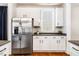 Bright kitchen with stainless steel refrigerator and hardwood floors at 1168 Great Ridge Pkwy, Chapel Hill, NC 27516