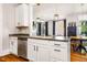 Bright kitchen with stainless steel appliances, granite countertops, and view of the dining and living area at 1168 Great Ridge Pkwy, Chapel Hill, NC 27516