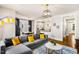 Open concept living and dining area with modern furnishings and hardwood floors at 1168 Great Ridge Pkwy, Chapel Hill, NC 27516